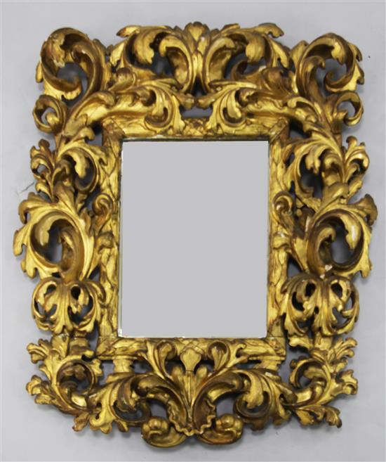 An 18th century Italian carved giltwood wall mirror, 3ft x 2ft 8in.